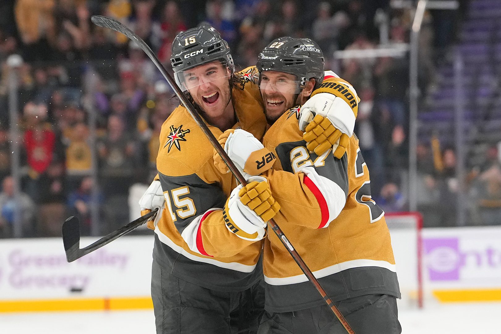 Two Vegas Golden Knights players hug and celebrate after scoring a third-period goal against the New York Rangers at T-Mobile Arena.