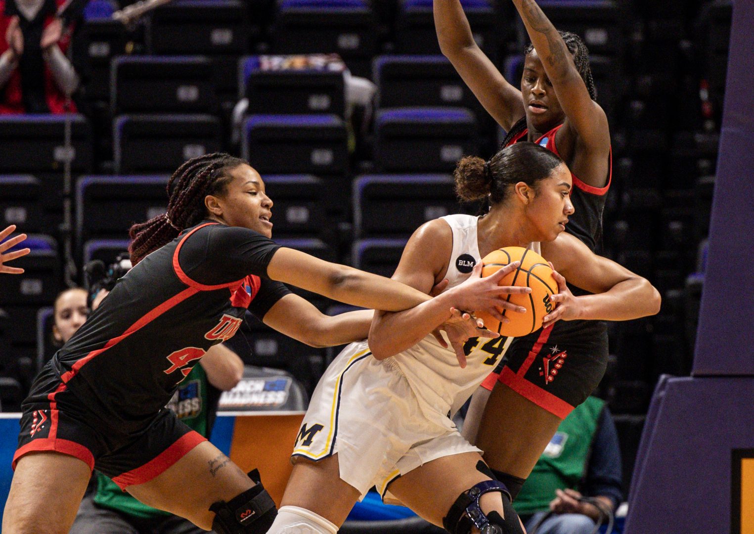 UNLV Lady Rebels forward Alyssa Brown (44) fouls Michigan Wolverines forward Cameron Williams (44) during the first half at Pete Maravich Assembly Center.