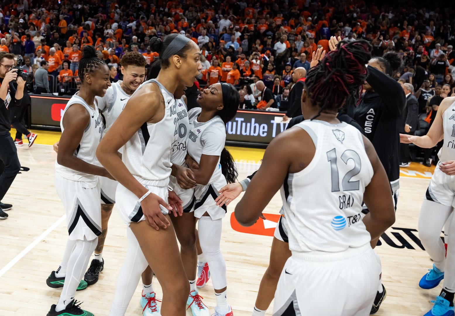 Phoenix, Arizona, USA; Las Vegas Aces center A'ja Wilson (22) celebrates with teammates after defeating the Phoenix Mercury during game three of the 2025 WNBA Finals at PHX Arena.