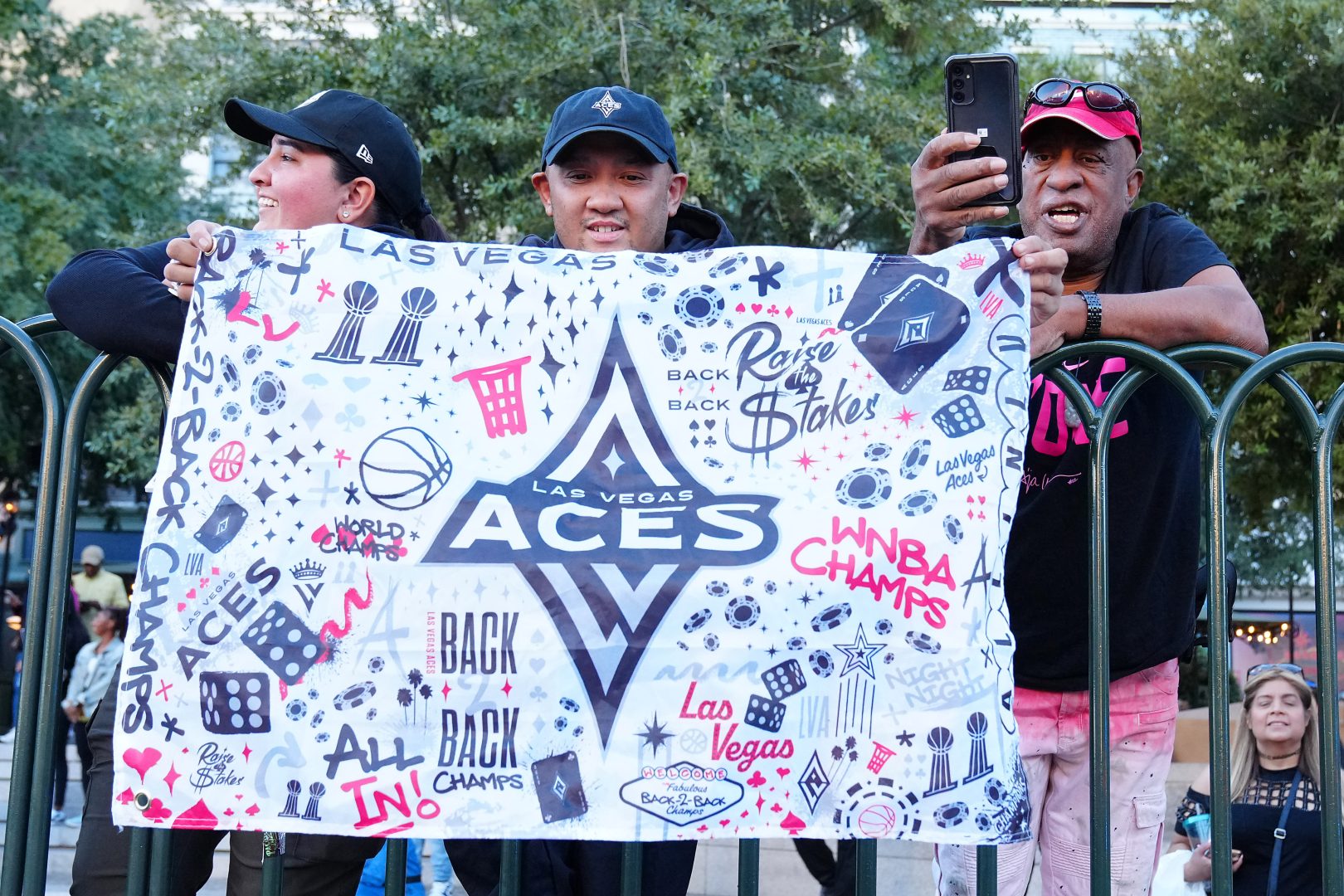 A Las Vegas Aces fan holds a sign during the Aces 2025 WNBA Championship parade at Toshiba Plaza. Mandatory