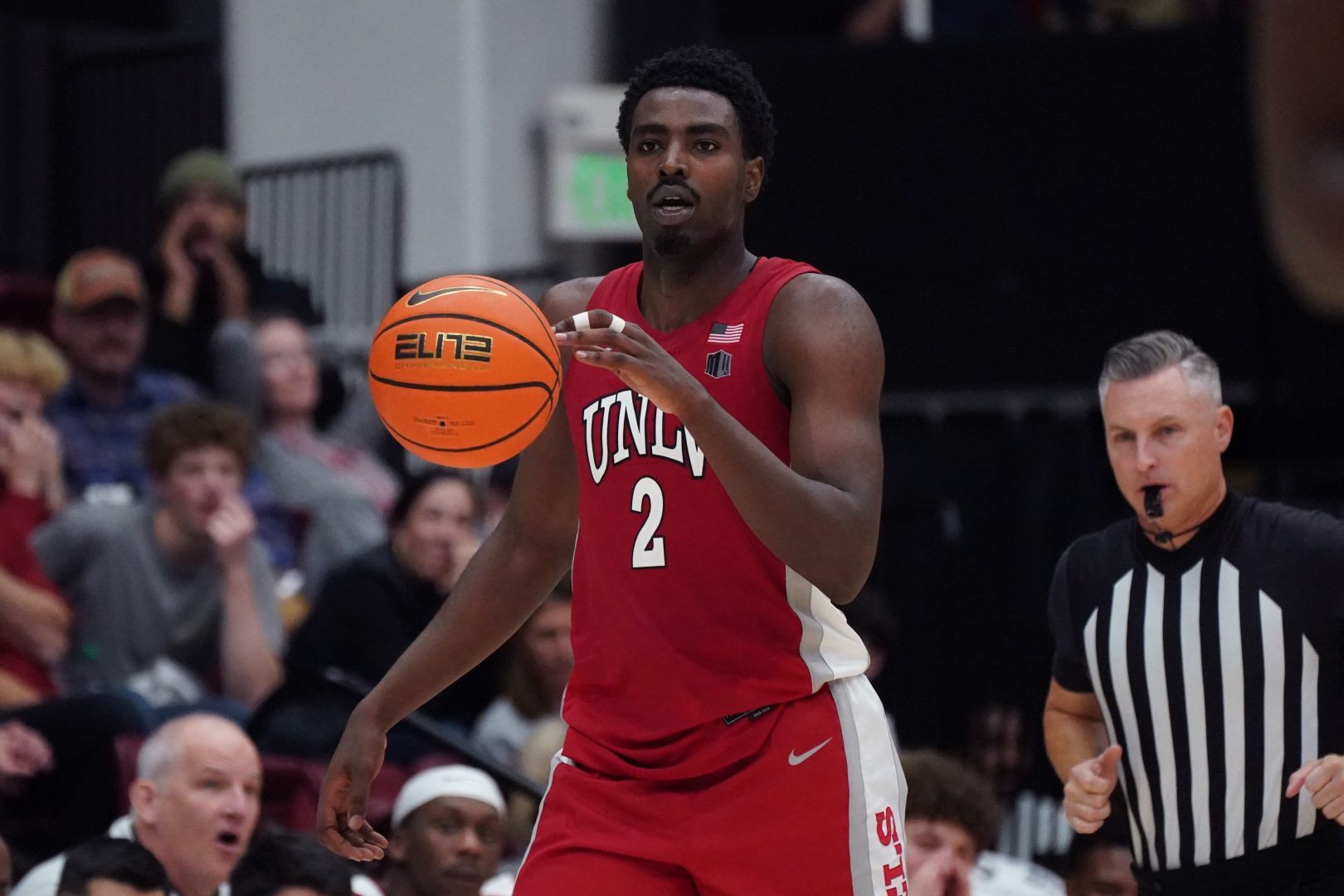 UNLV forward Kimani Hamilton dribbles upcourt against Stanford at Maples Pavilion.