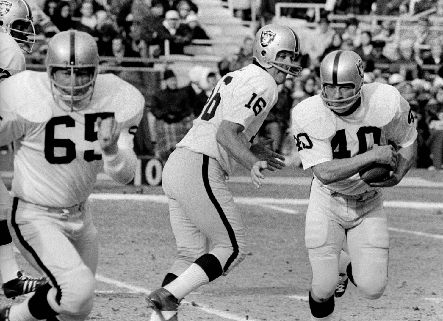 File photo: Oakland Raiders guard Wayne Hawkins (65) blocks as running back Pete Banaszak (40) follows against the New York Jets at Shea Stadium.