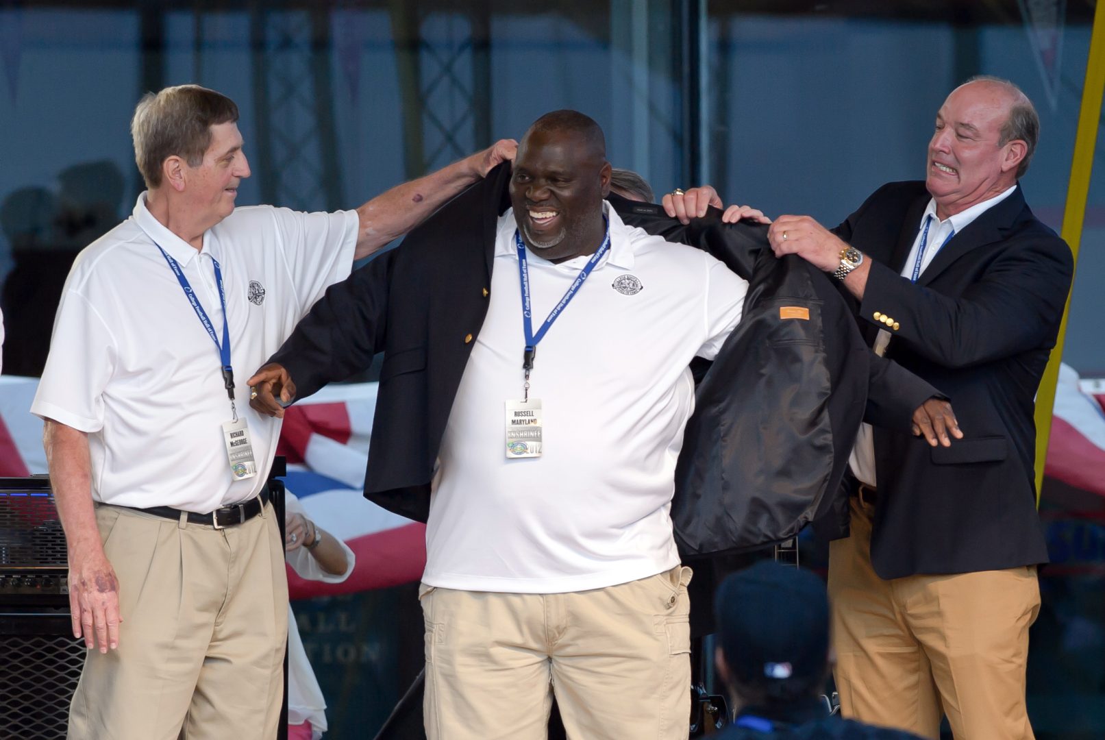 File photo: Former Raiders defensive tackle Russell Maryland smiles as he receives a Hall of Fame blazer at a College Football Hall of Fame event.
