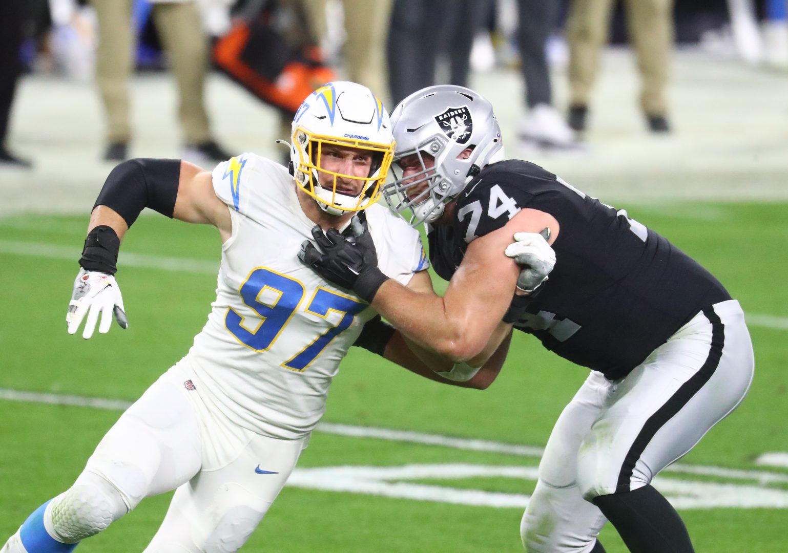 File photo: Las Vegas Raiders tackle Kolton Miller (74) blocks Chargers pass rusher Joey Bosa (97) at Allegiant Stadium.