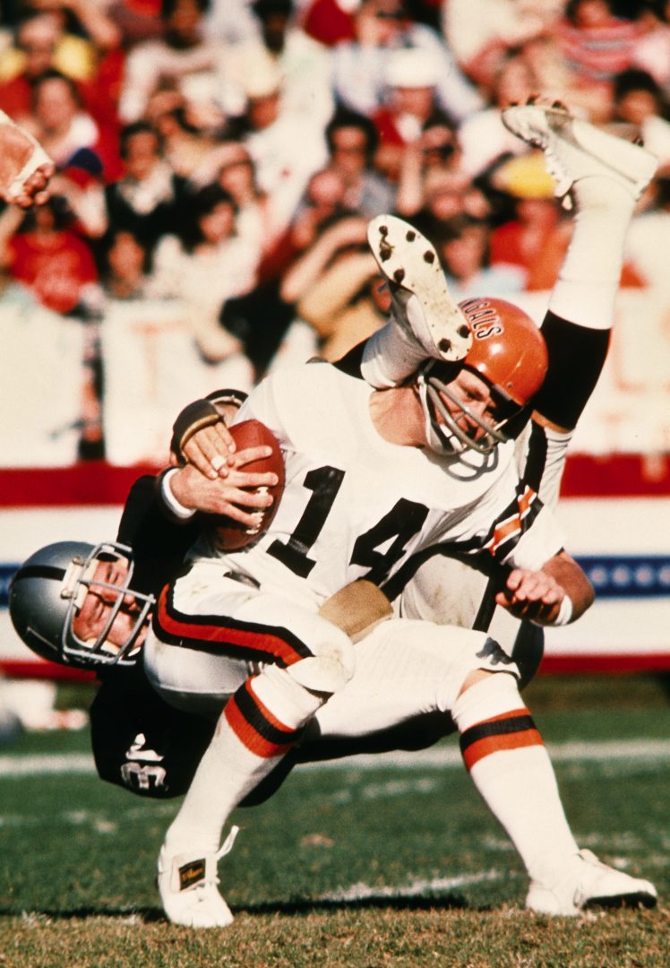 File photo: Oakland Raiders defensive tackle Art Thoms (80) tackles Cincinnati Bengals QB Ken Anderson (14) in the 1975 AFC divisional playoffs.