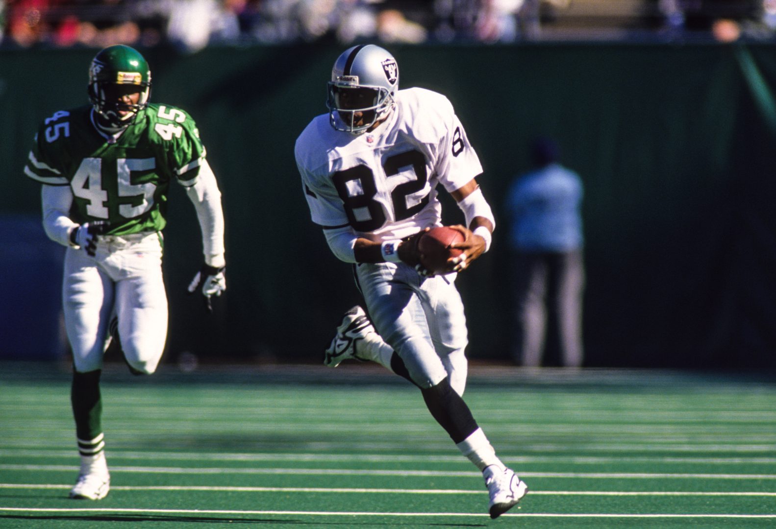 File photo: Oakland Raiders wide receiver James Jett (82) runs with the ball against the New York Jets at Giants Stadium.