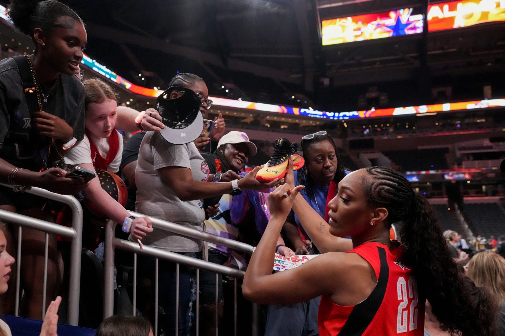 Las Vegas Aces' A’ja Wilson (22) signs autographs for fans Saturday, July 19, 2025, after the WNBA All-Star Game at Gainbridge Fieldhouse in Indianapolis.