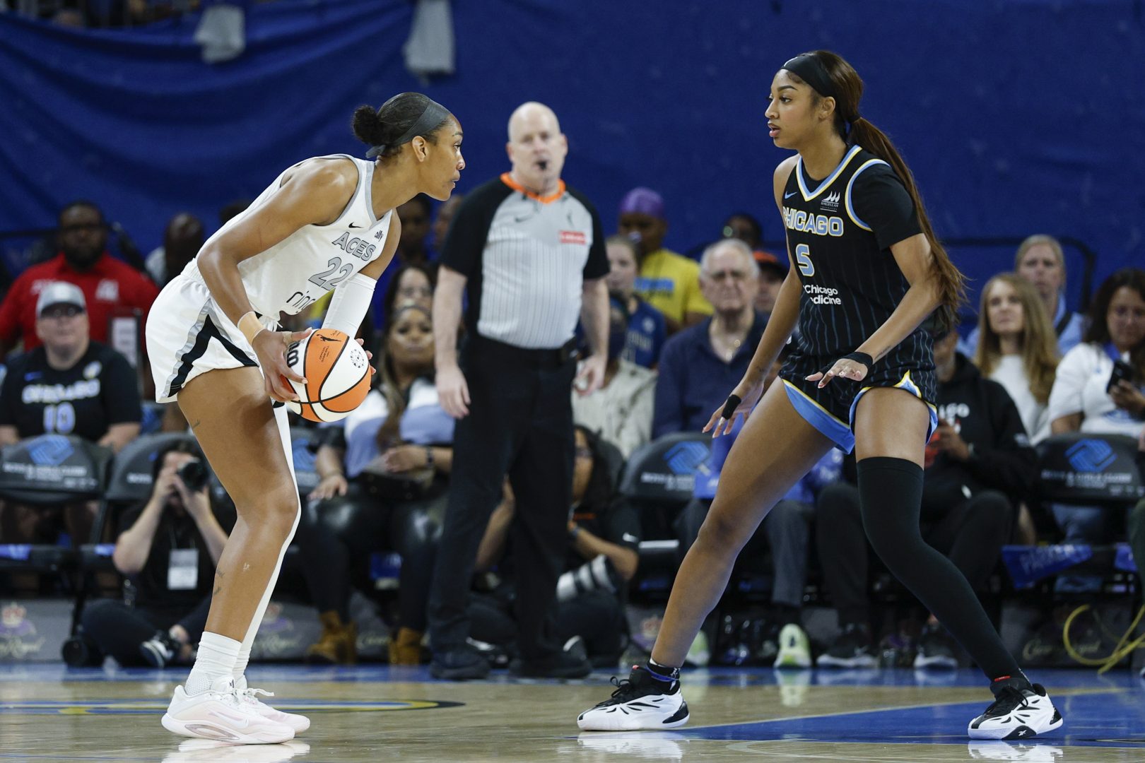 Chicago, Illinois, USA; Chicago Sky forward Angel Reese (5) defends against Las Vegas Aces center A'ja Wilson (22) during the first half at Wintrust Arena.