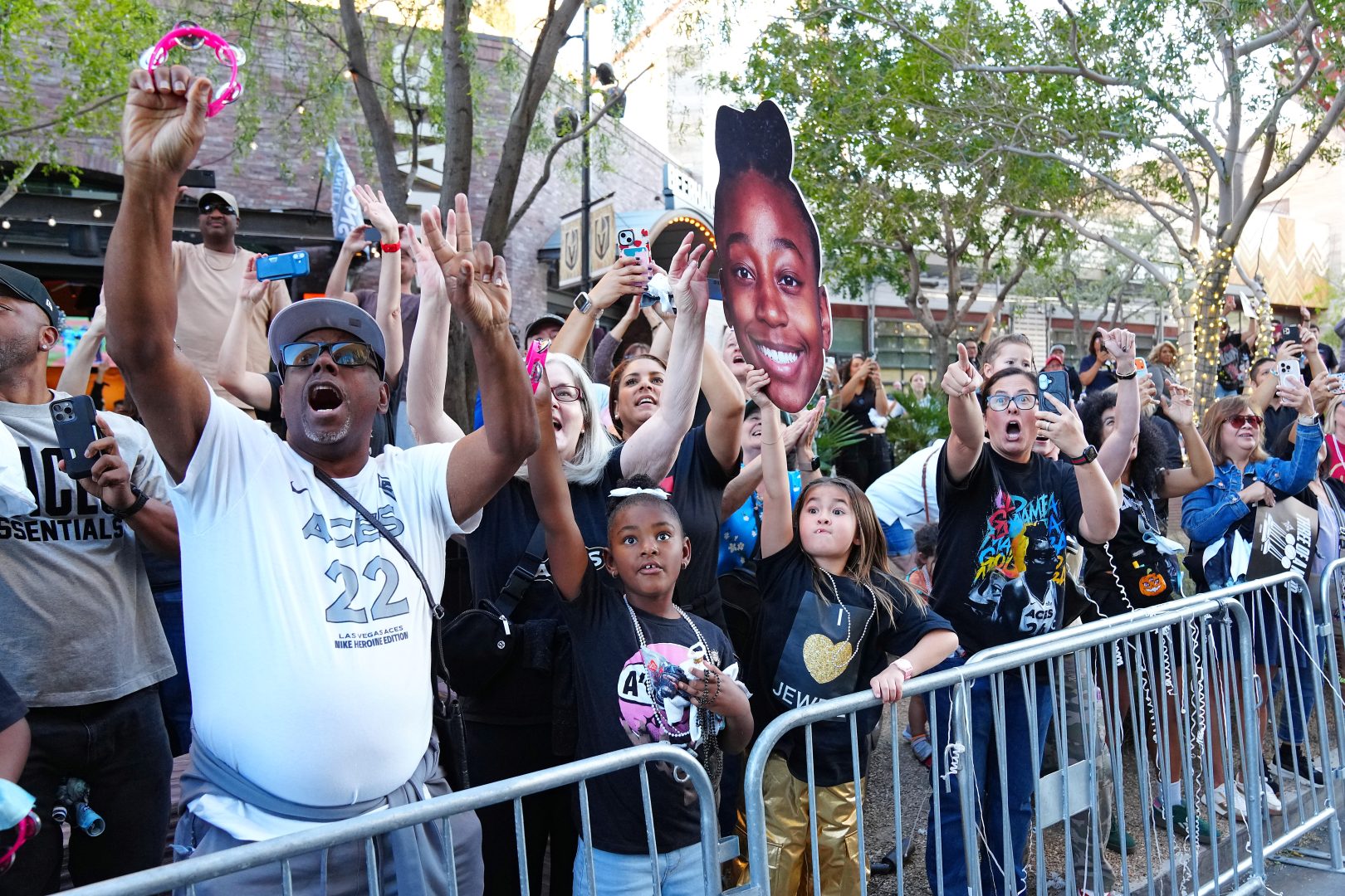 Las Vegas Aces fans cheer during the Aces 2025 WNBA Championship parade near Toshiba Plaza.