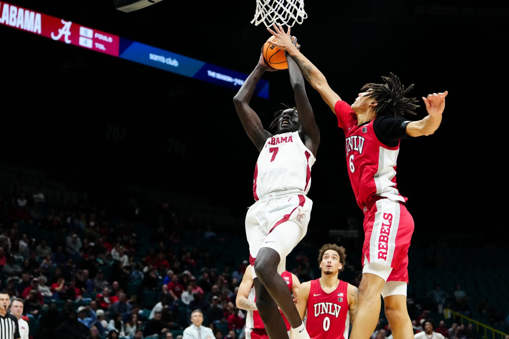 Alabama Crimson Tide forward Taylor Bol Bowen (7) shoots while defended by UNLV Rebels forward Tyrin Jones (6) in the first half in a 2025 Players Era Festival group play game at MGM Grand Garden Arena.