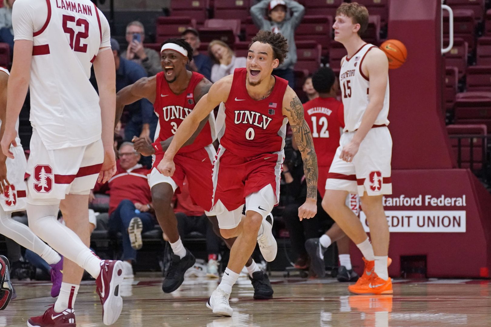 UNLV guard Dra Gibbs-Lawhorn celebrates with Emmanuel Stephen after the final buzzer vs Stanford at Maples Pavilion.
