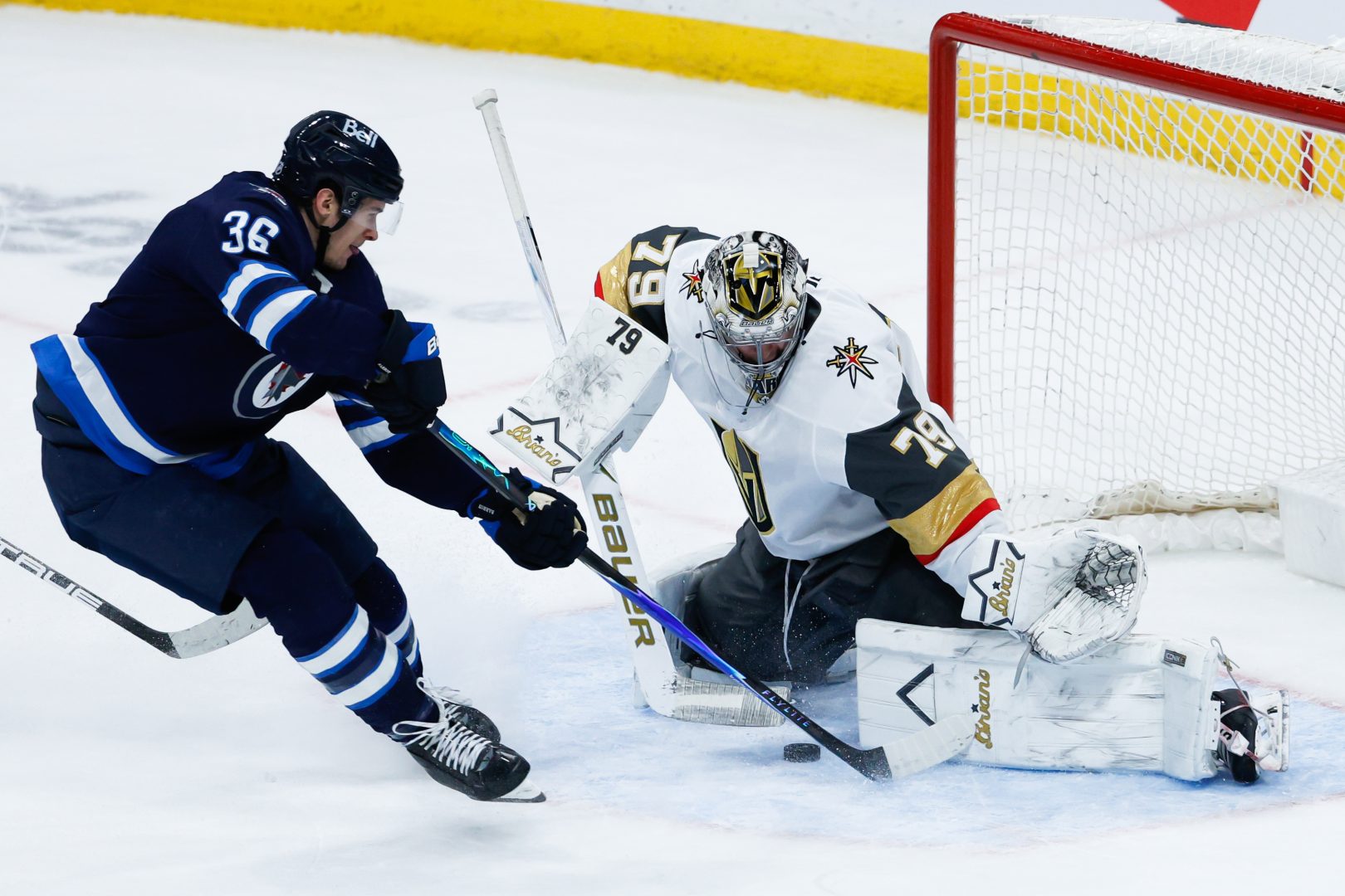 Vegas Golden Knights goalie Carter Hart blocks a shot from Winnipeg Jets forward Morgan Barron in overtime at Canada Life Centre.