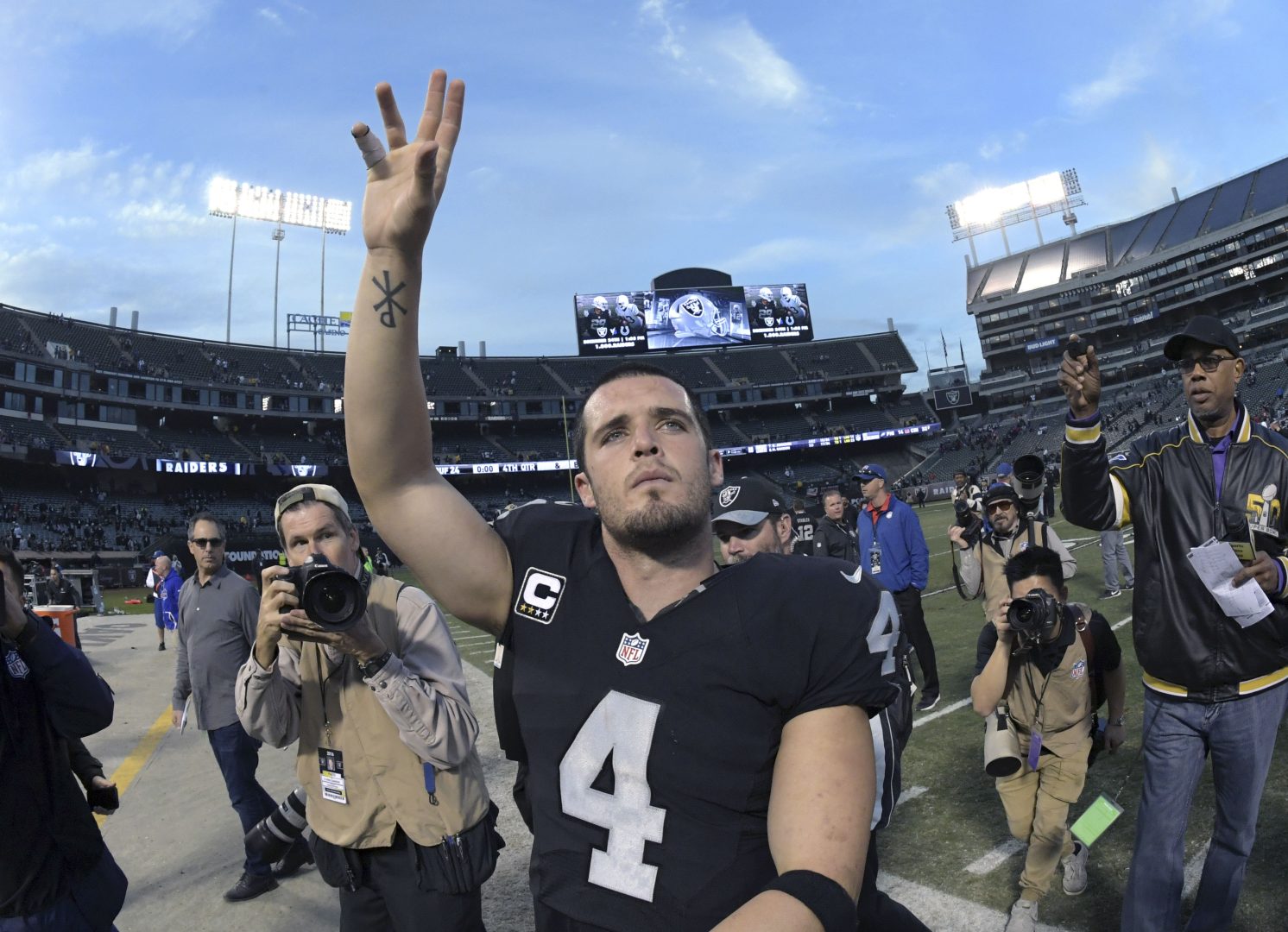 File photo: Oakland Raiders quarterback Derek Carr celebrates after a win over the Buffalo Bills at Oakland Coliseum.