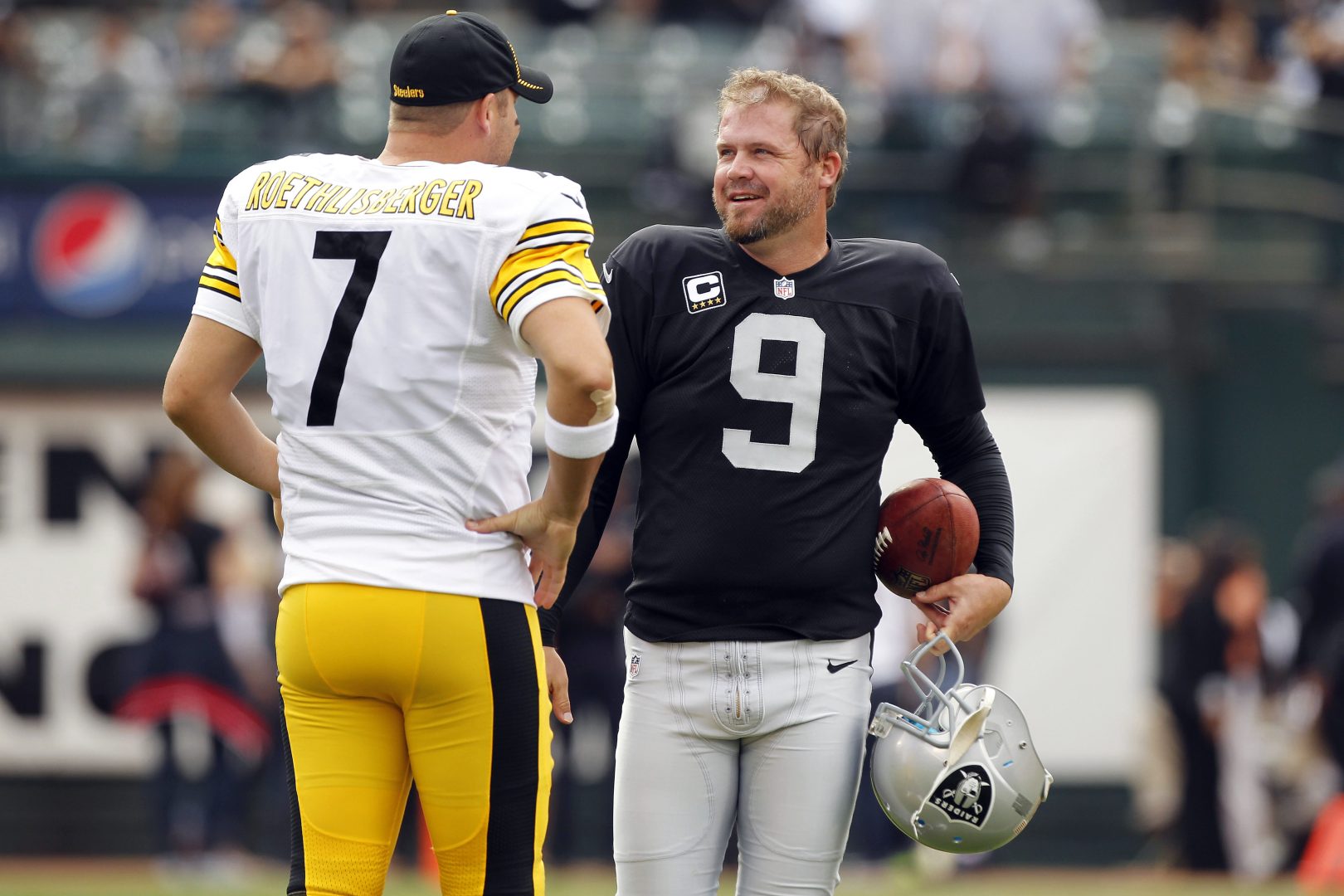 File photo: Oakland Raiders punter Shane Lechler meets with Steelers quarterback Ben Roethlisberger before kickoff at O.co Coliseum.