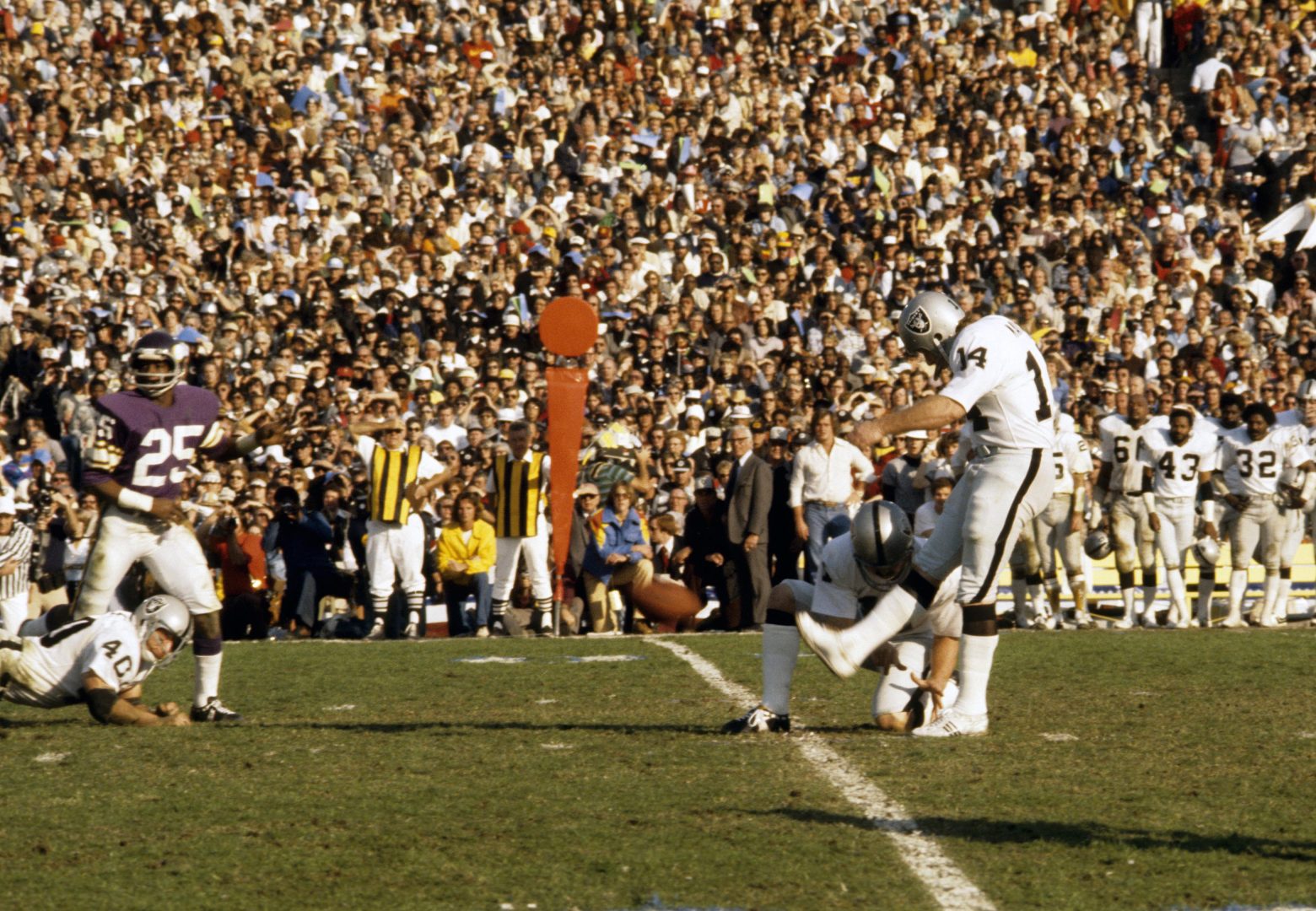File photo: Oakland Raiders kicker Errol Mann kicks a field goal against the Minnesota Vikings in Super Bowl XI.