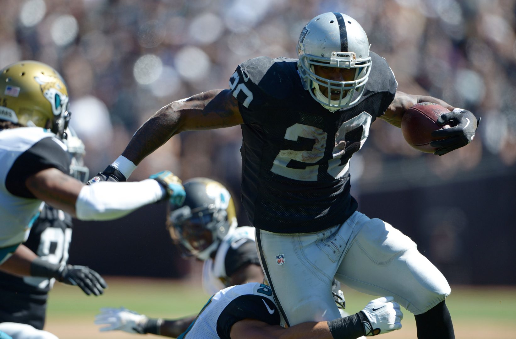 File photo: Oakland Raiders running back Darren McFadden carries the ball against the Jacksonville Jaguars at O.co Coliseum.