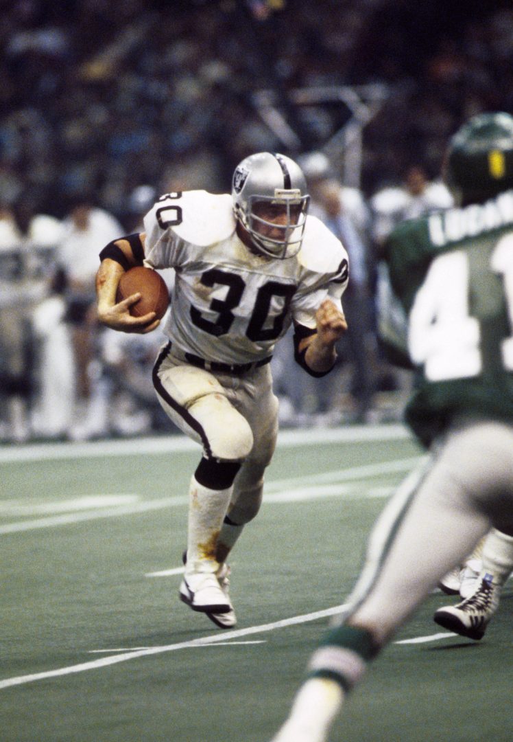 File photo: Oakland Raiders running back Mark van Eeghen carries the ball against the Philadelphia Eagles in Super Bowl XV.
