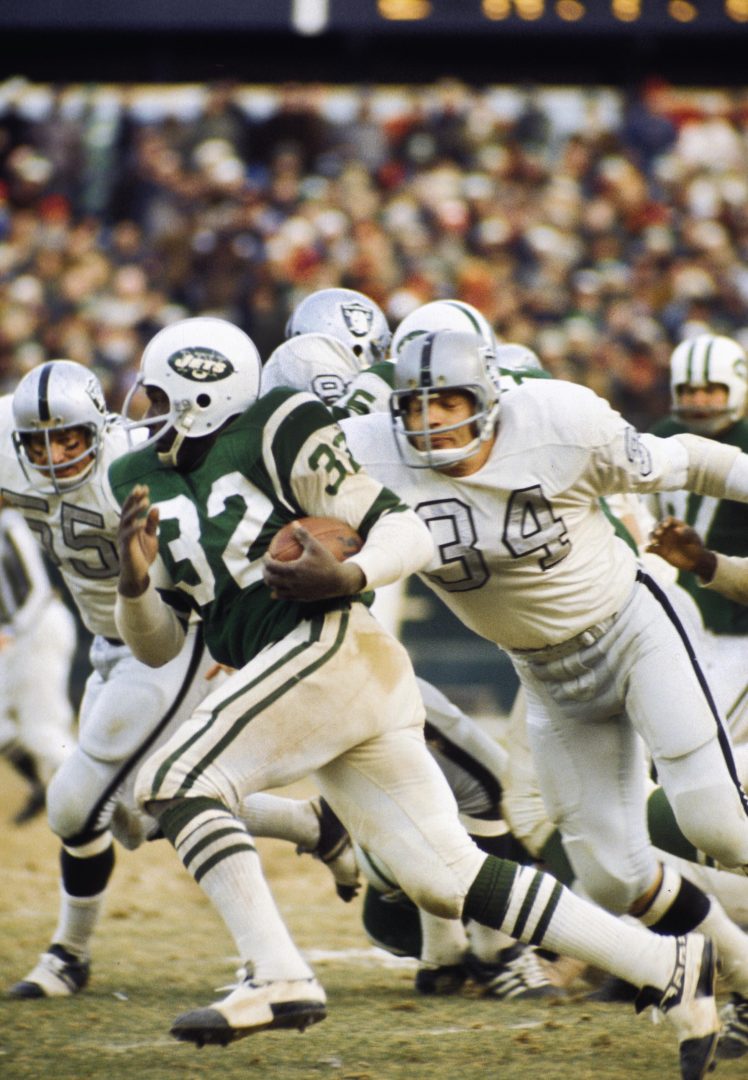 File photo: Oakland Raiders linebacker Gus Otto (34) closes in on Jets running back Emerson Boozer (32) at Shea Stadium.