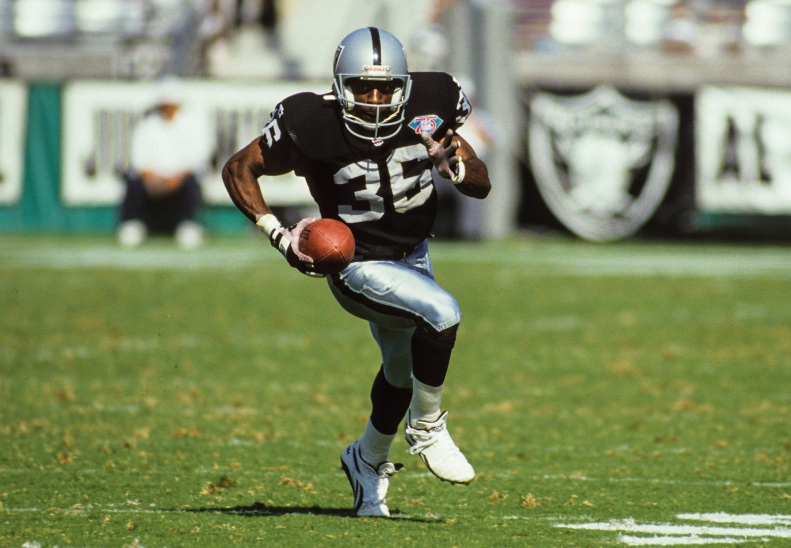File photo: Los Angeles Raiders defensive back Terry McDaniel (36) fields a kickoff against the Seattle Seahawks at Los Angeles Memorial Coliseum.