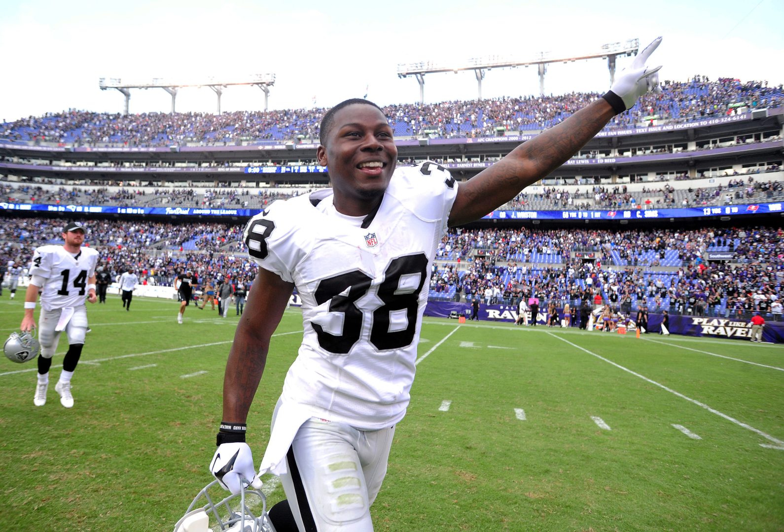 File photo: Oakland Raiders cornerback T.J. Carrie (38) celebrates on the field after a win over the Baltimore Ravens at M&T Bank Stadium.