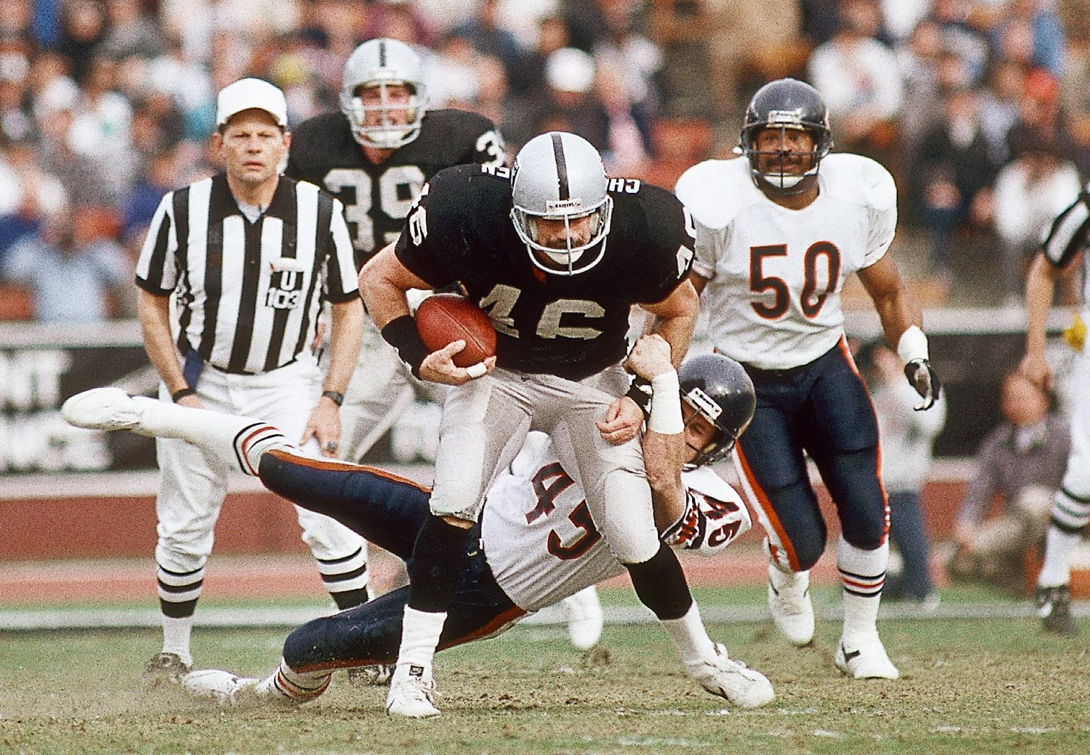 File photo: Los Angeles Raiders tight end Todd Christensen (46) catches a pass against the Chicago Bears at Los Angeles Memorial Coliseum.