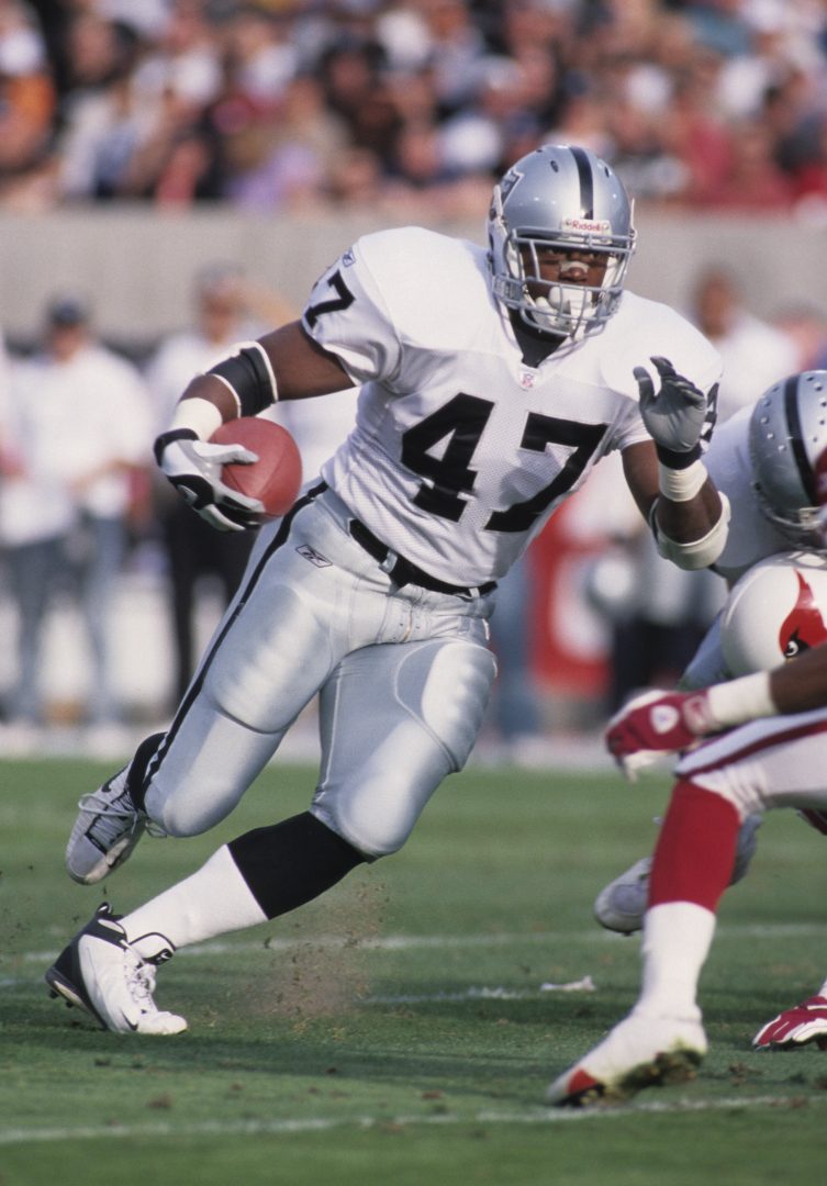 File photo: Oakland Raiders running back Tyrone Wheatley (47) runs with the ball against the Arizona Cardinals at Sun Devil Stadium.