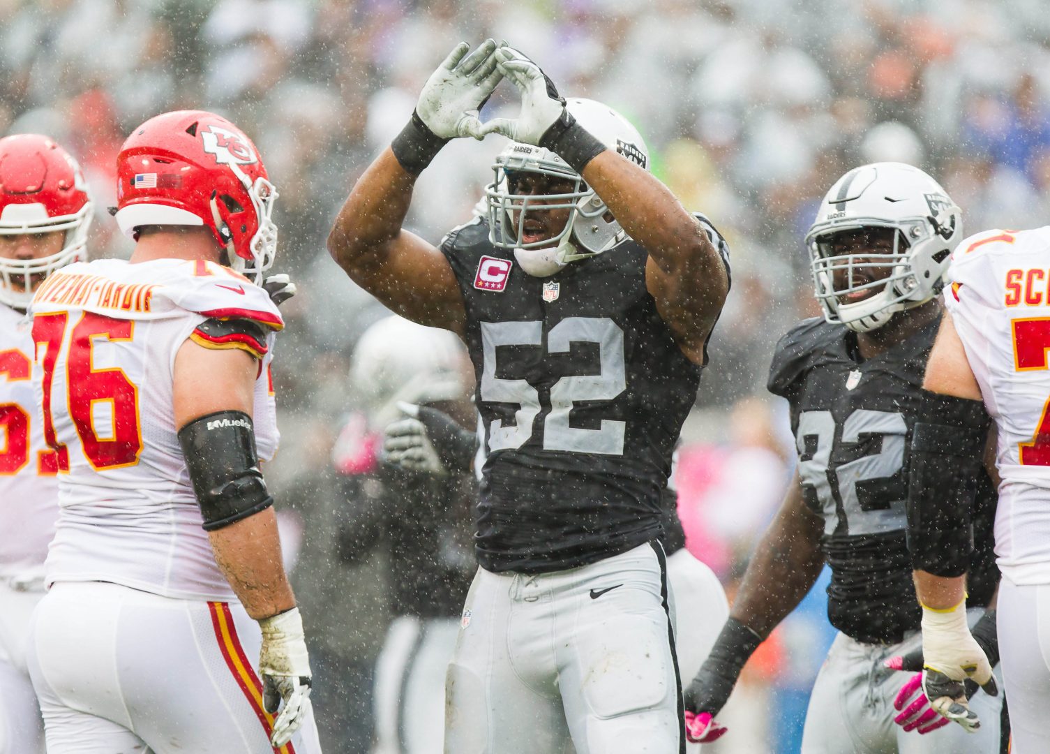 File photo: Oakland Raiders defensive end Khalil Mack (52) raises his arms to celebrate after a first-quarter sack against the Kansas City Chiefs at Oakland Coliseum.