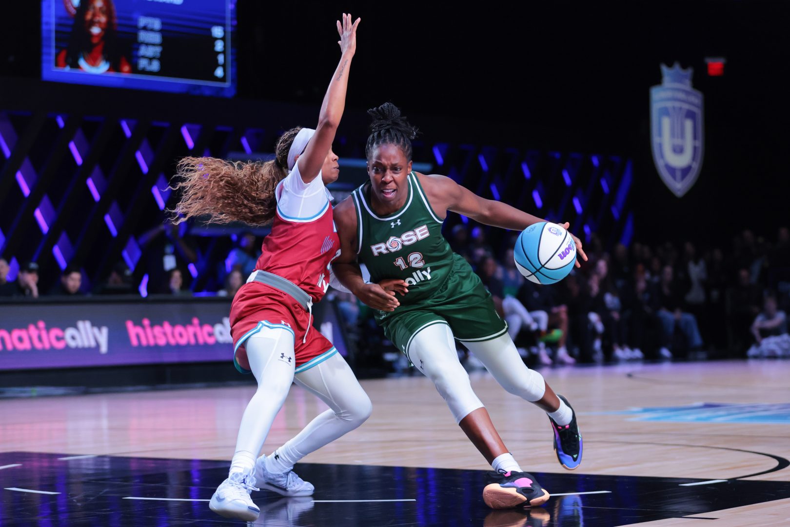 Rose BC guard Chelsea Gray (12) drives to the basket against Vinyl BC guard Jordin Canada (3) during the third quarter of the Unrivaled Championship game at Wayfair Arena.