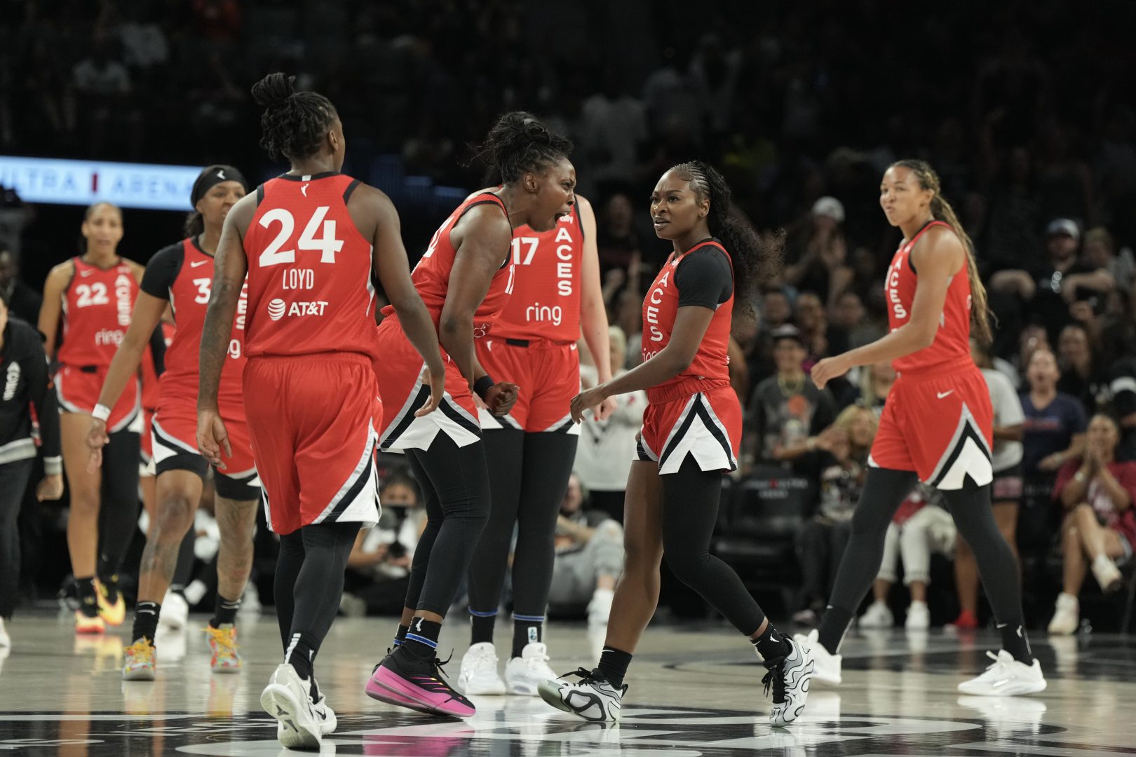 Las Vegas Aces guard Chelsea Gray (12) reacts to guard Dana Evans (11) during a timeout in the second quarter of their game against the Atlanta Dream at Michelob Ultra Arena.