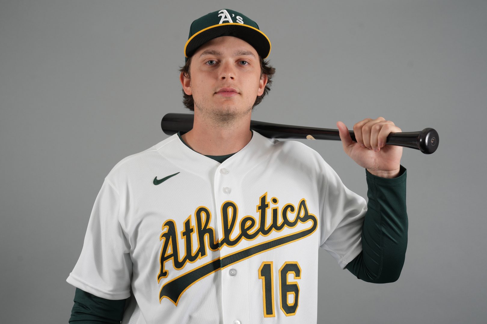 Athletics first baseman Nick Kurtz poses with a bat during photo day at Hohokam Stadium in Mesa, Arizona.