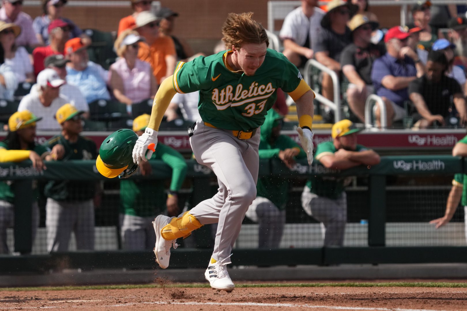 Athletics outfielder Henry Bolte runs toward first base in the third inning against the Giants at Scottsdale Stadium.