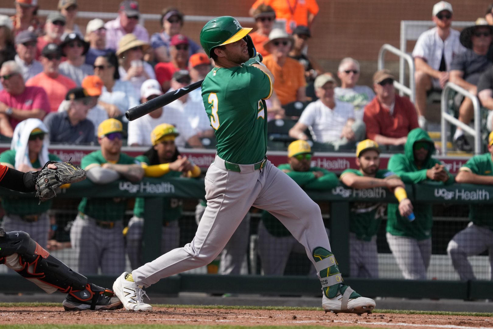 Athletics third baseman Max Muncy singles in the third inning against the Giants at Scottsdale Stadium.
