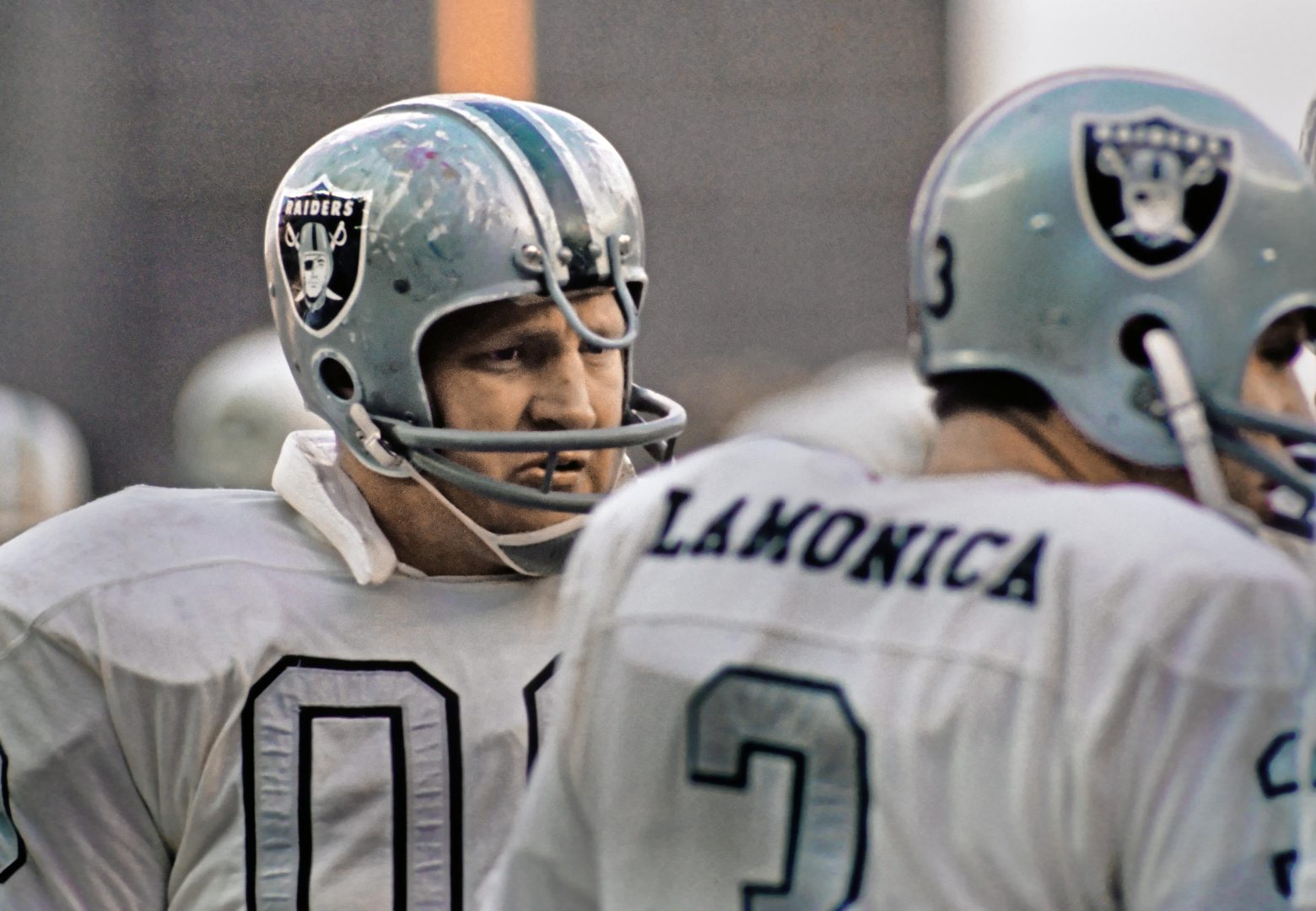 File photo: Oakland Raiders center Jim Otto talks with quarterback Daryle Lamonica on the sideline at Shea Stadium.