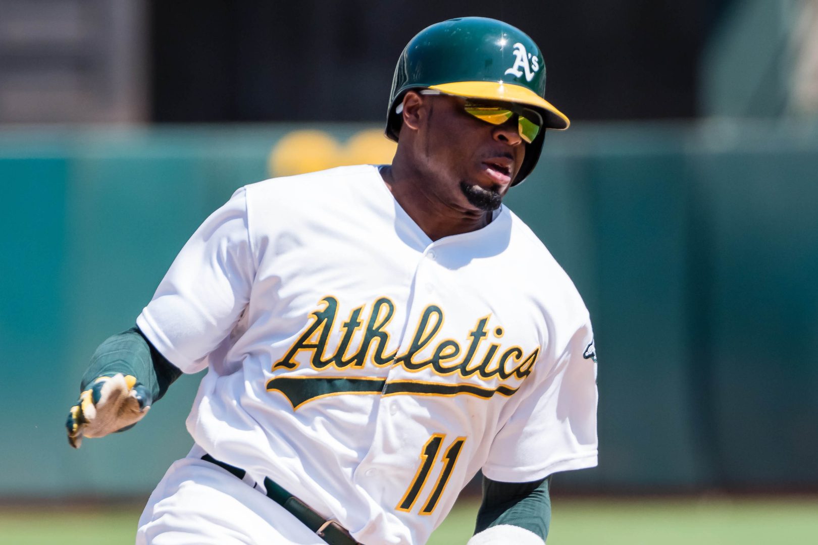 Athletics center fielder Rajai Davis rounds third base against the Kansas City Royals during the fifth inning at Oakland Coliseum in Oakland.