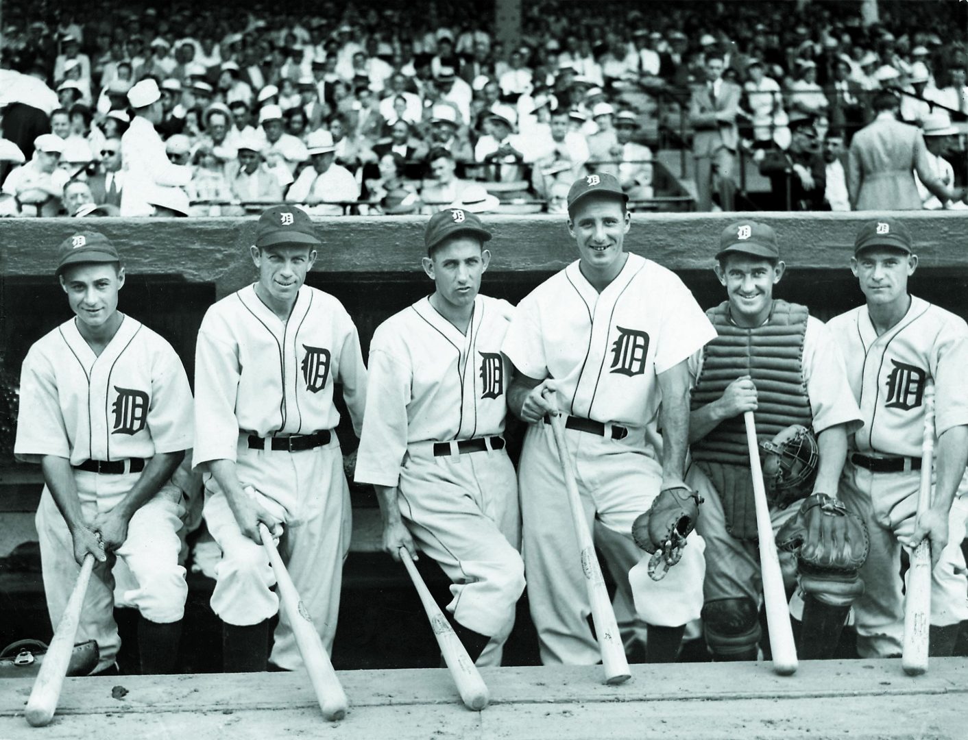 Athletics catcher Mickey Cochrane stands with teammates in a posed group photo with the 1935 Tigers.