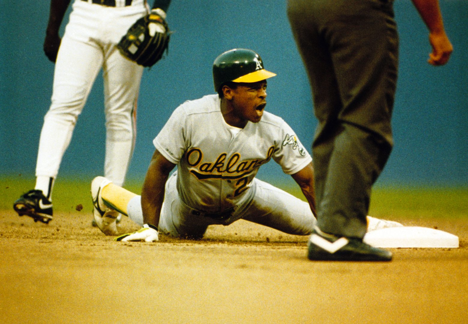 Athletics left fielder Rickey Henderson is in action during the 1990 season.