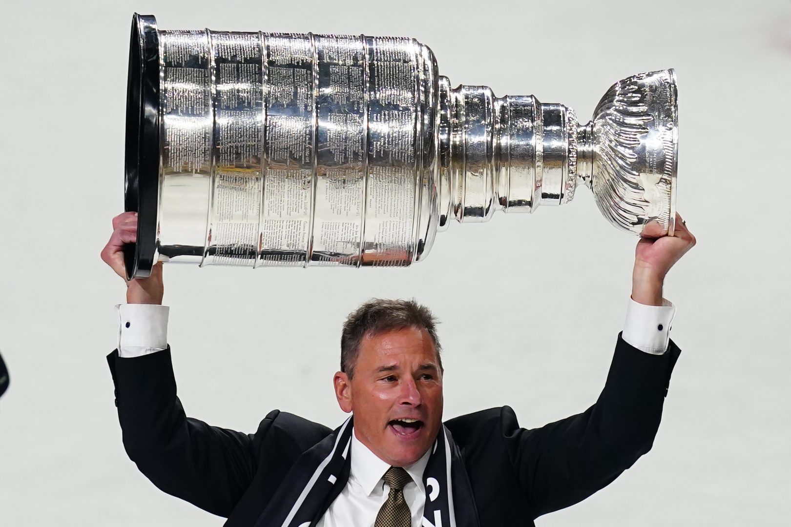 Bruce Cassidy lifts the Stanley Cup at T-Mobile Arena after the Golden Knights won the 2023 Stanley Cup Final