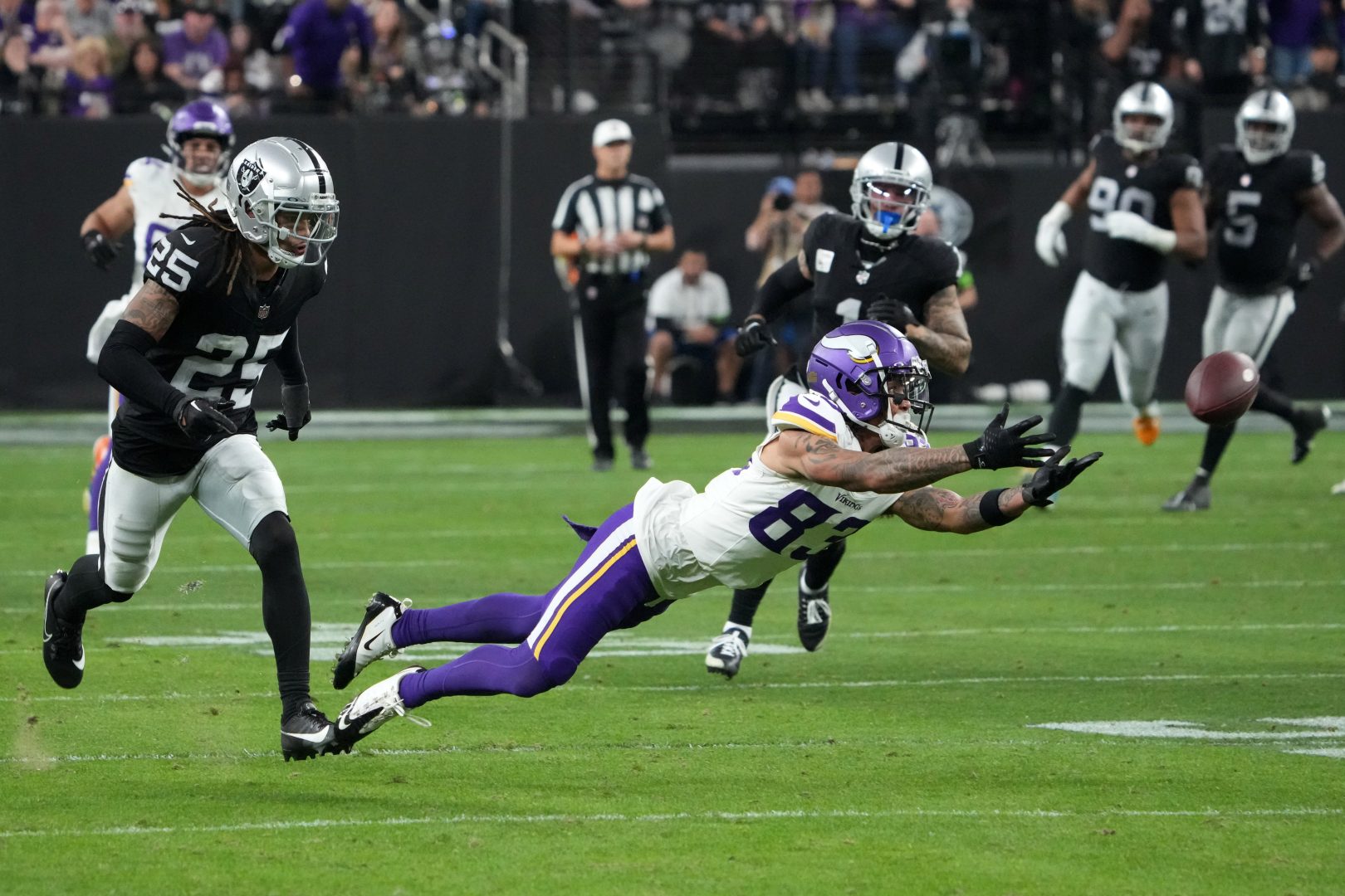 Vikings receiver Jalen Nailor is defended by Raiders safety Tre’von Moehrig during a December 2023 game at Allegiant Stadium in Las Vegas.
