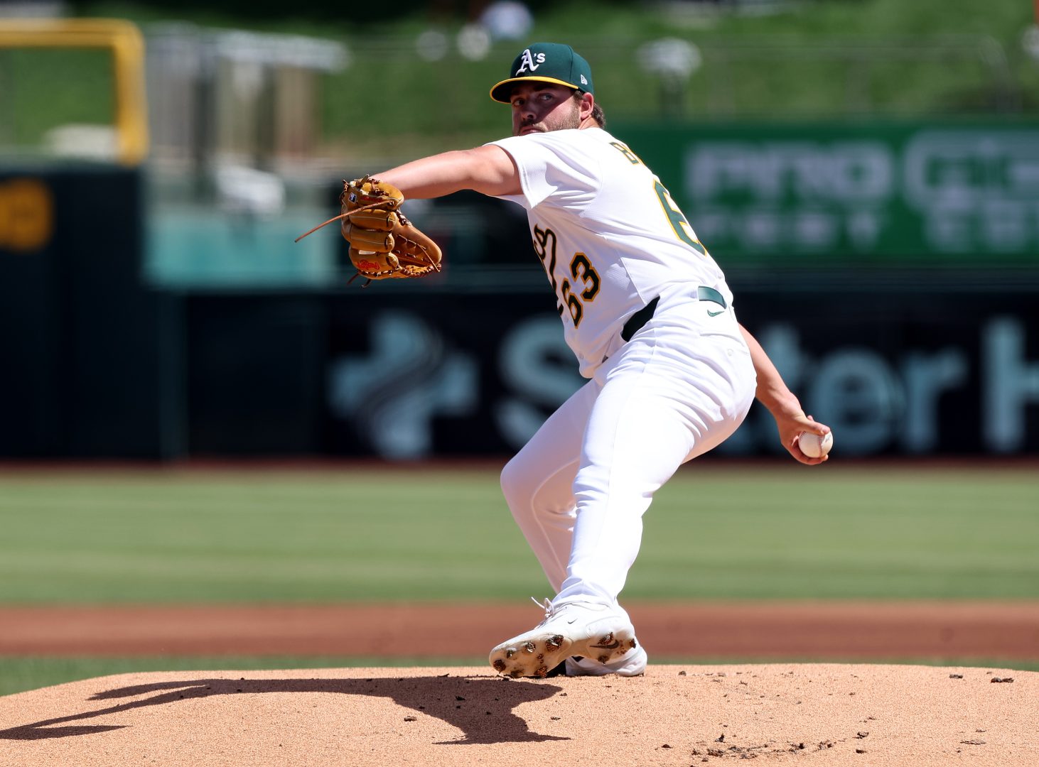 Athletics right-hander Mason Barnett delivers a first-inning pitch against the Red Sox at Sutter Health Park.