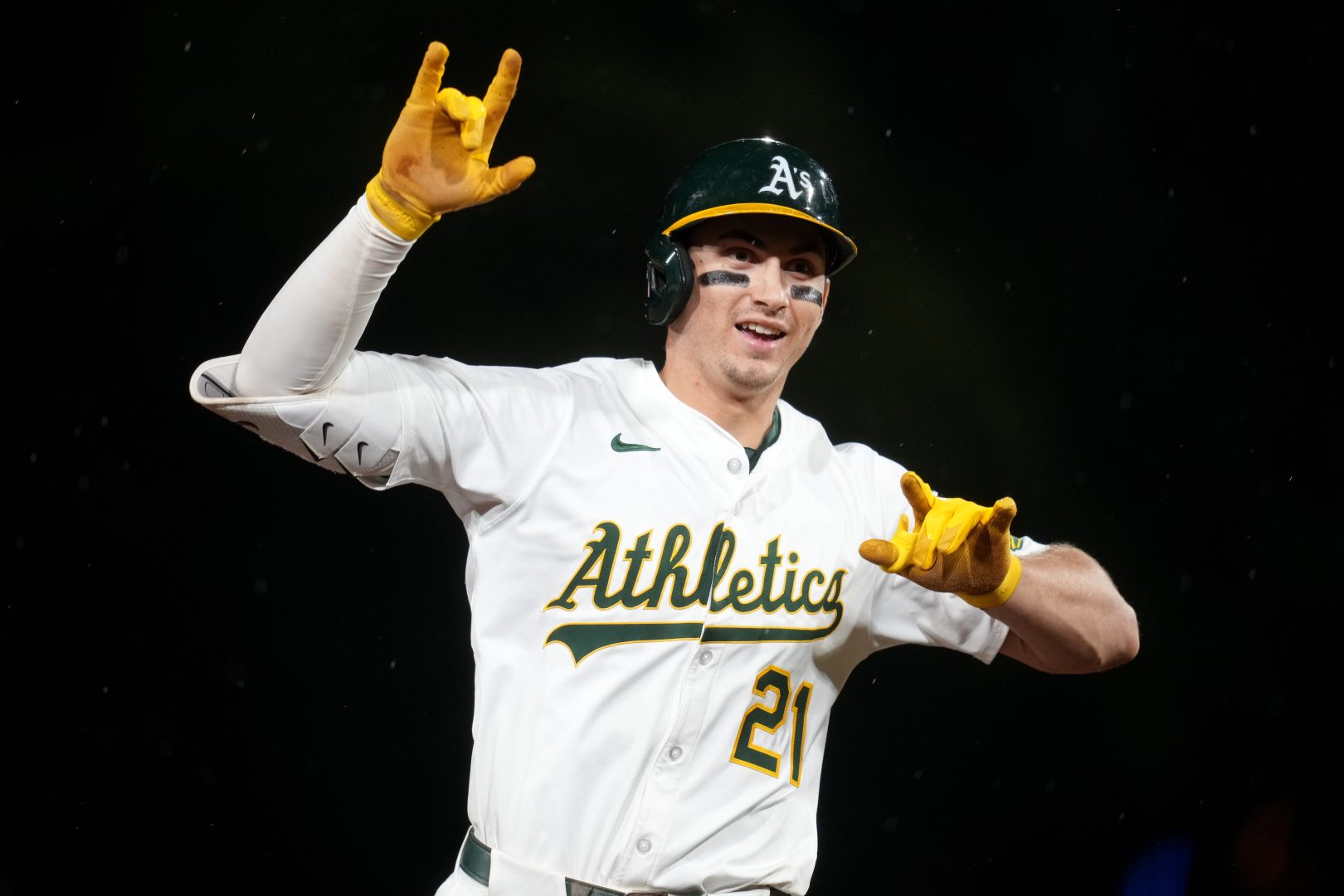 Athletics outfielder Tyler Soderstrom raises both hands as he rounds the bases after a home run at Sutter Health Park in West Sacramento.