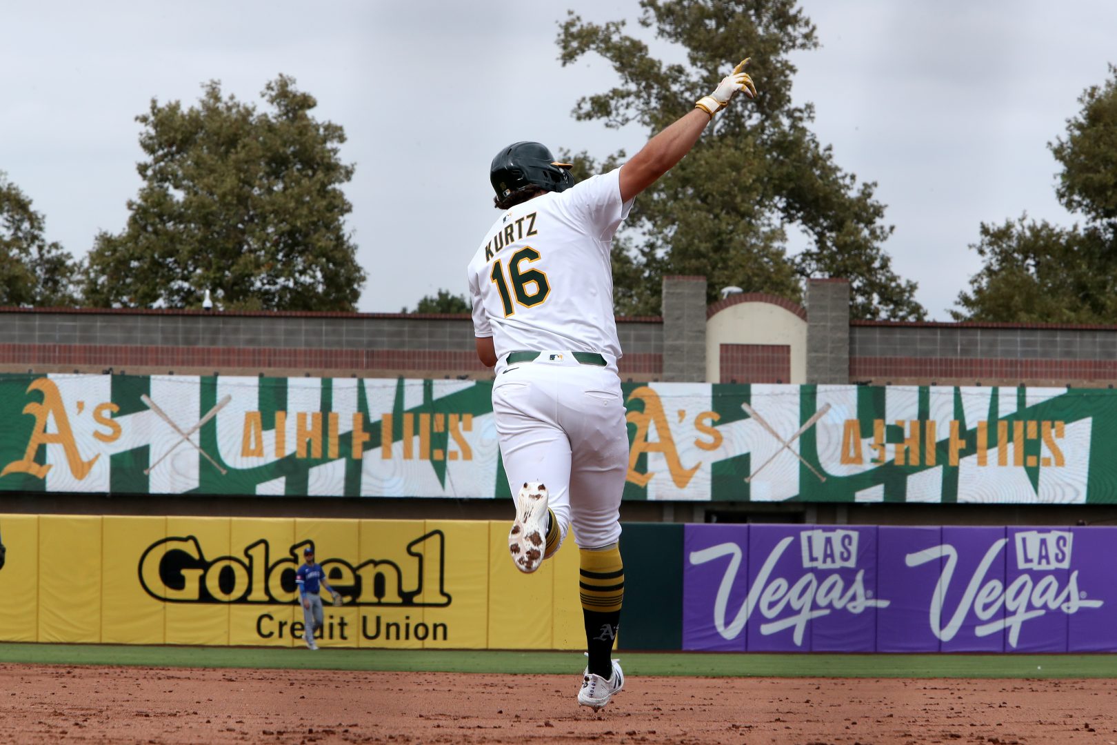 Athletics first baseman Nick Kurtz jumps into the air while celebrating after hitting a home run during a game at Sutter Health Park.