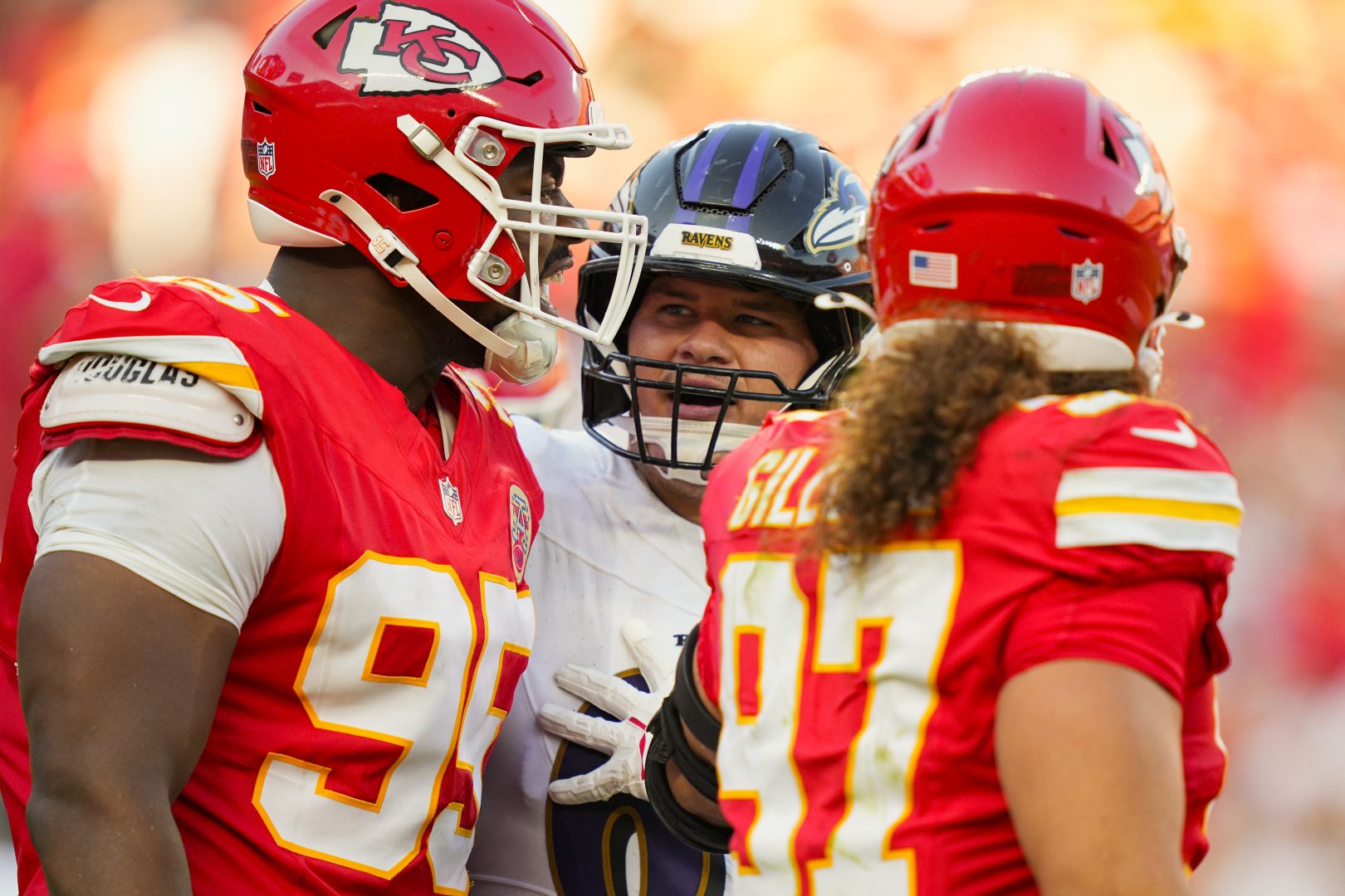 Baltimore Ravens center Tyler Linderbaum talks with Kansas City Chiefs defensive end Chris Jones at Arrowhead Stadium on Sept. 28, 2025.