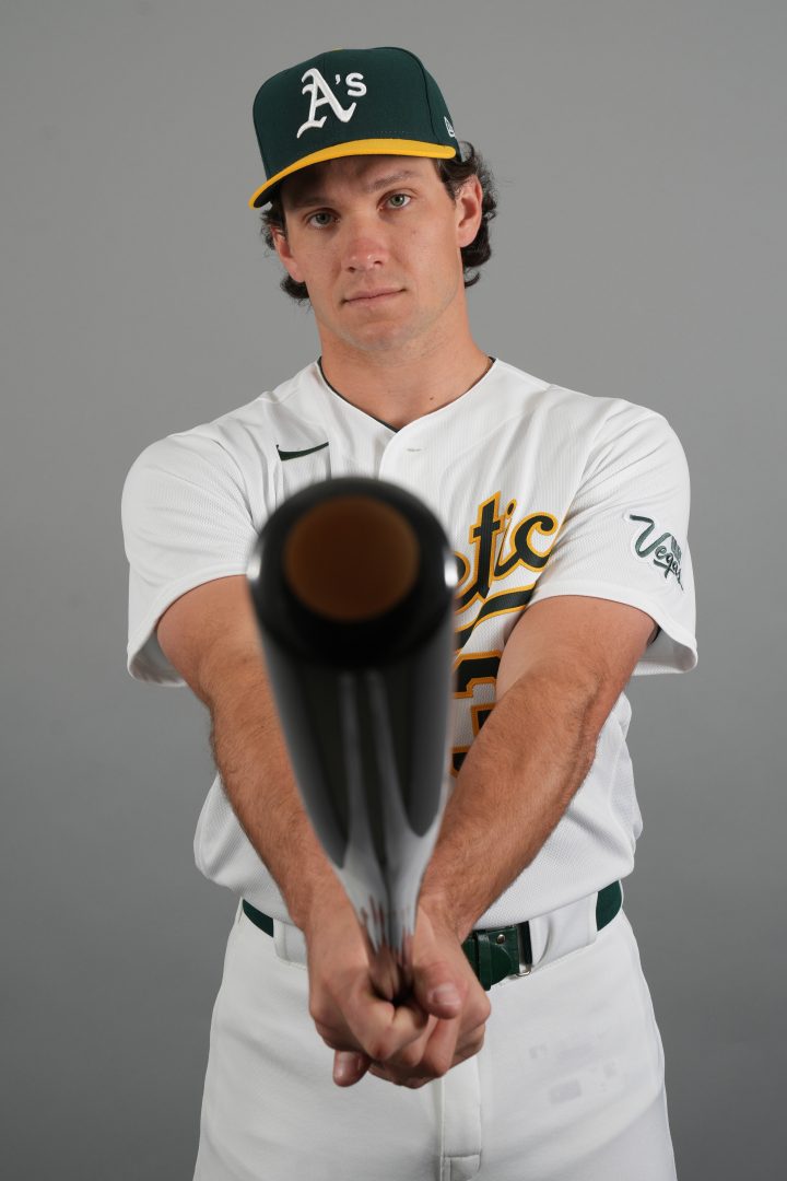 Athletics outfielder Colby Thomas poses holding a bat during the team’s Photo Day at Hohokam Stadium in Mesa, Arizona.