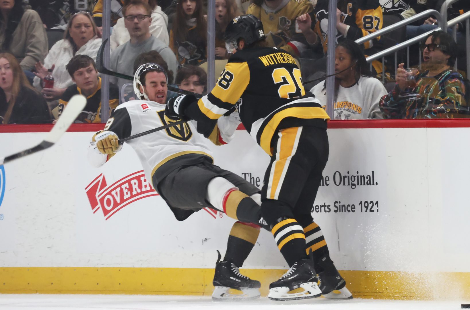 Pittsburgh Penguins defenseman Parker Wotherspoon checks Vegas Golden Knights forward Reilly Smith into the boards during first period at PPG Paints Arena on March 1, 2026.