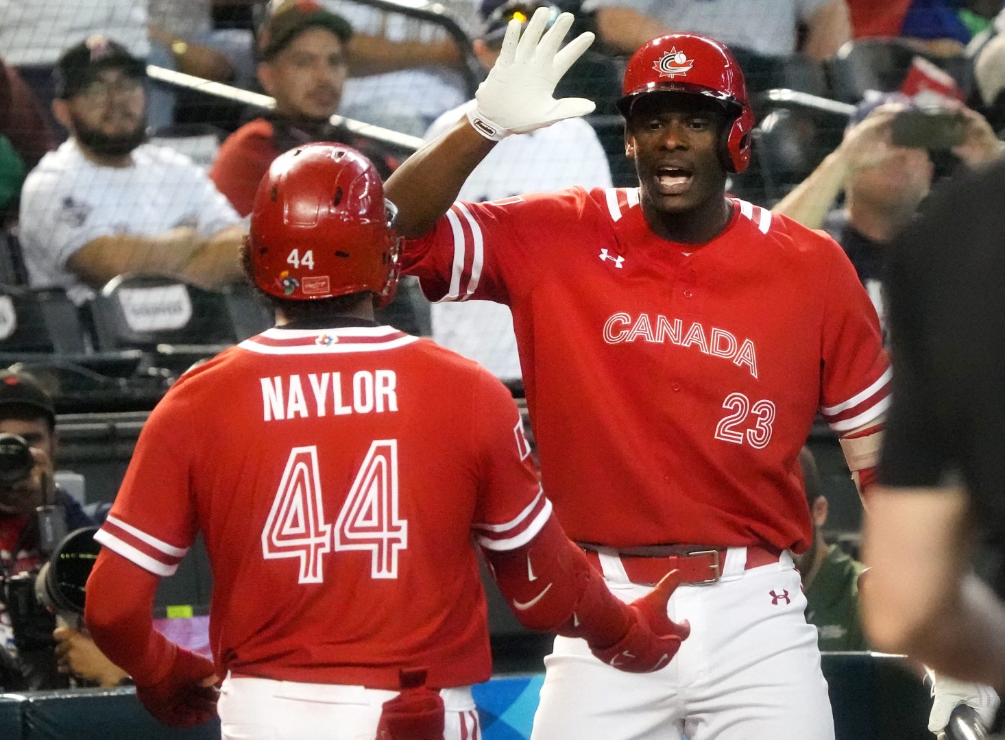 Canada outfielder Denzel Clarke celebrates with Bo Naylor after a home run during the 2023 World Baseball Classic.