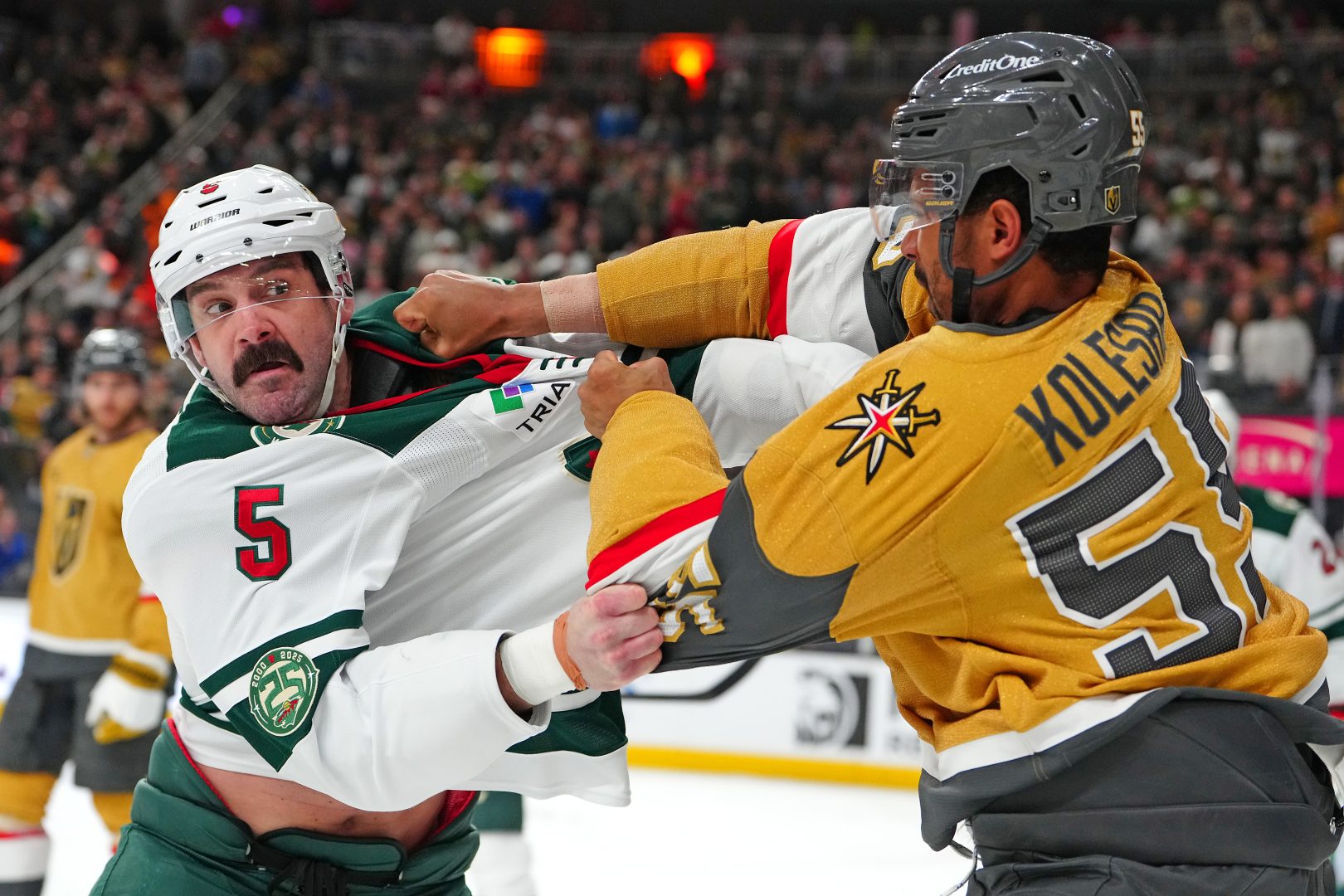 Vegas Golden Knights forward Keegan Kolesar fights Minnesota Wild defenseman Jake Middleton during the second period at T-Mobile Arena in Las Vegas on March 6, 2026.