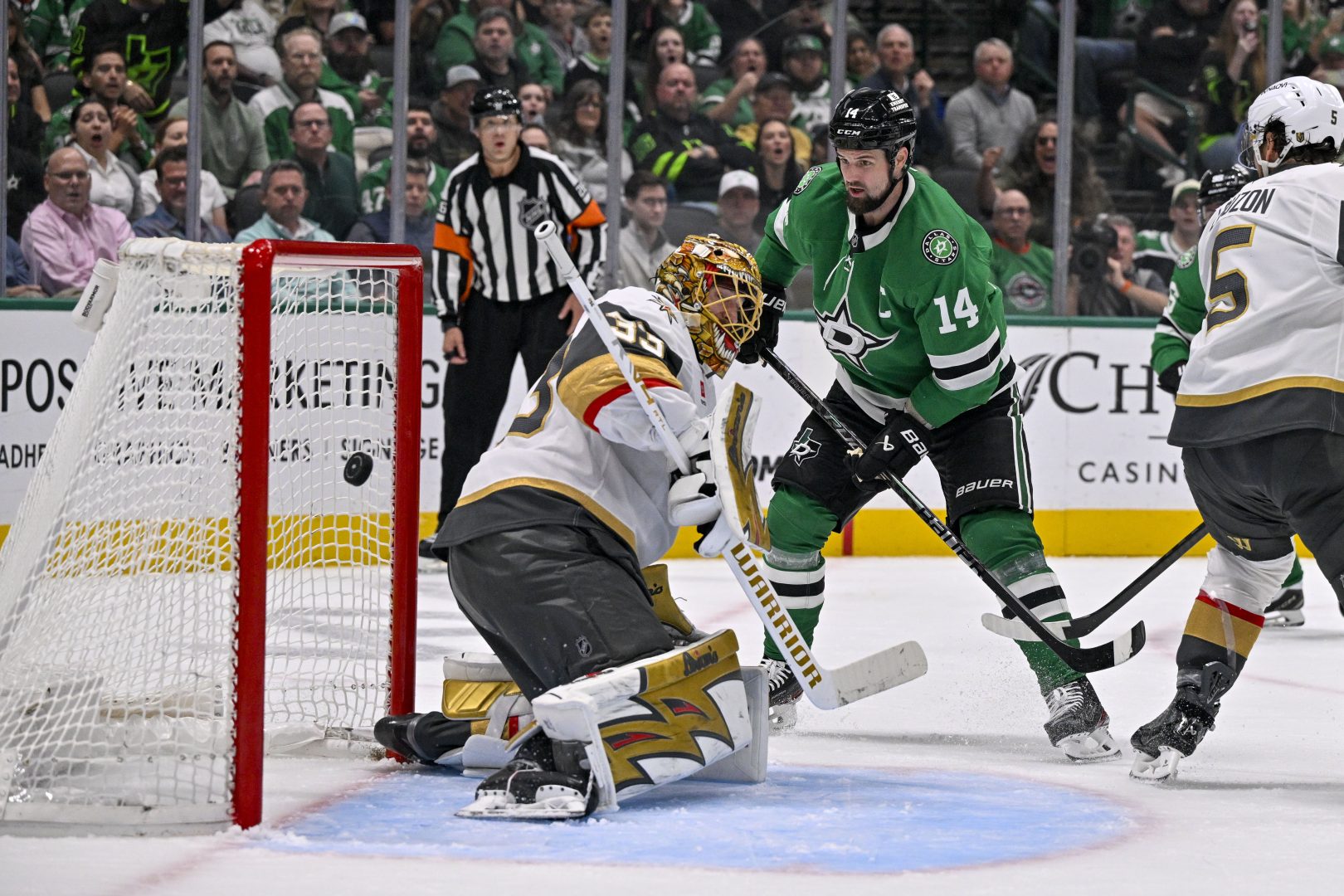 Jamie Benn redirects the puck past Vegas Golden Knights goalie Adin Hill during the second period against the Dallas Stars at American Airlines Center on March 10, 2026.