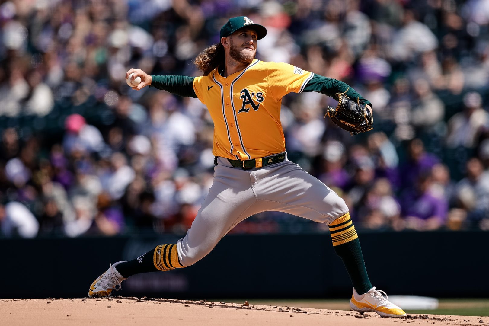 Athletics pitcher Joey Estes delivers a pitch during a 2025 game at Coors Field in Denver.