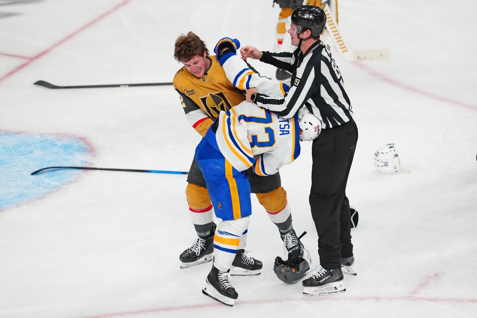 Vegas Golden Knights forward Braeden Bowman faces Buffalo Sabres defenseman Zach Metsa during a third-period scrum at T-Mobile Arena on March 17, 2026.