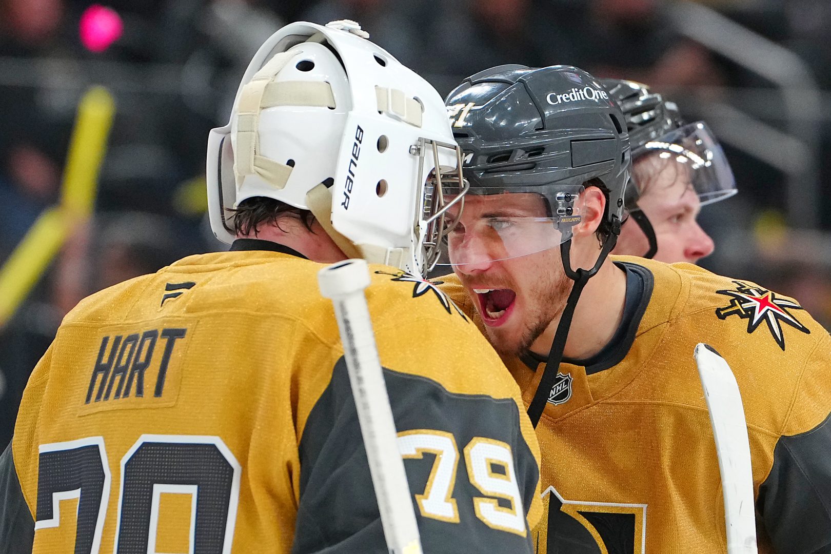 Brett Howden congratulates goaltender Carter Hart after the Golden Knights’ 6-3 win over the Flames, part of Vegas’ late push in the Pacific Division race.